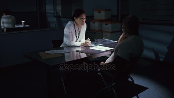 Female Police Detective Questioning Crime Suspect Interrogation Room — Stock Video