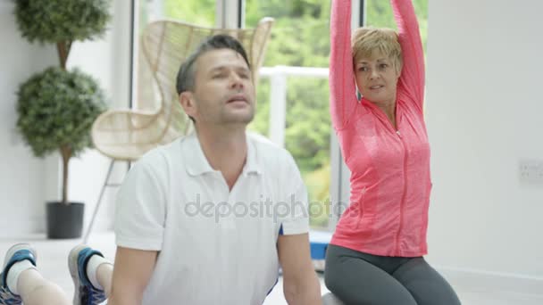 Healthy Mature Couple Working Out Together Doing Yoga Stretches — Stock Video