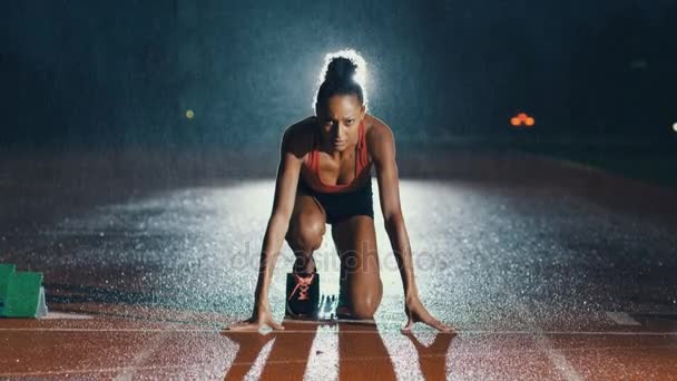 Female Athlete Training Running Track Dark Rain — Stock Video