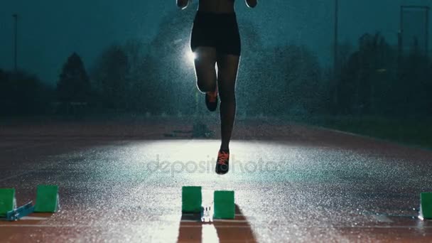 Female Athlete Training Running Track Dark Rain — Stock Video