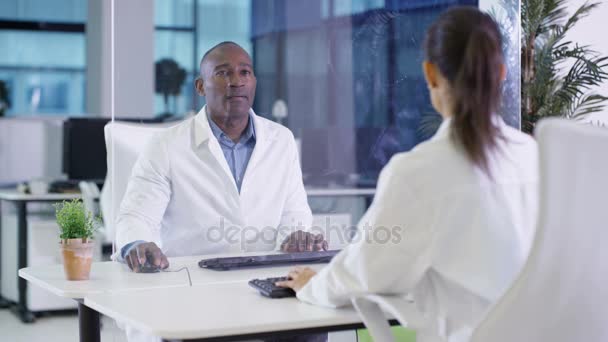 Scientists White Coats Using Interactive Touch Screen Lab — Stock Video