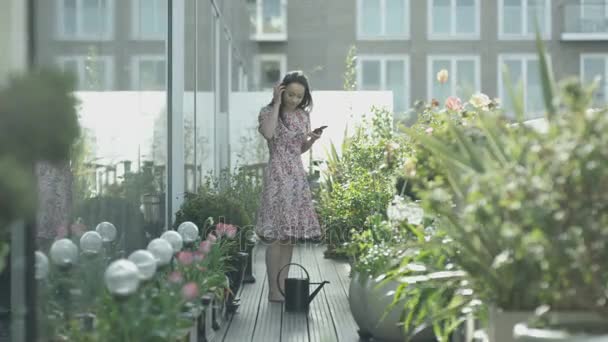 Attractive Young Woman Watering Her Plants City Rooftop Garden — Stock Video