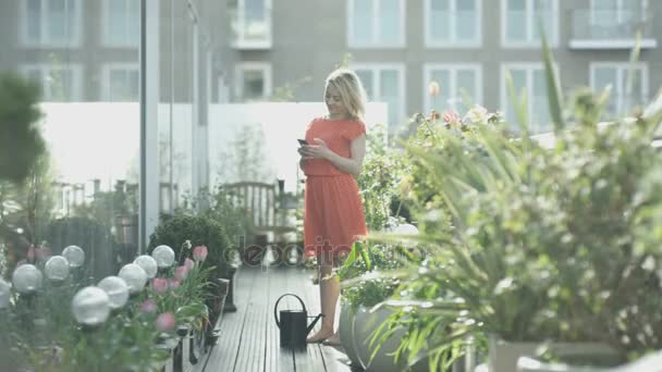 Attractive Young Woman Watering Her Plants City Rooftop Garden — Stock Video
