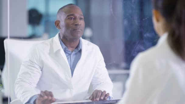 Scientists White Coats Using Interactive Touch Screen Lab — Stock Video