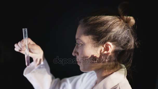 Scientist Looking Test Tube Scenes War Projected Her Face — Stock Video