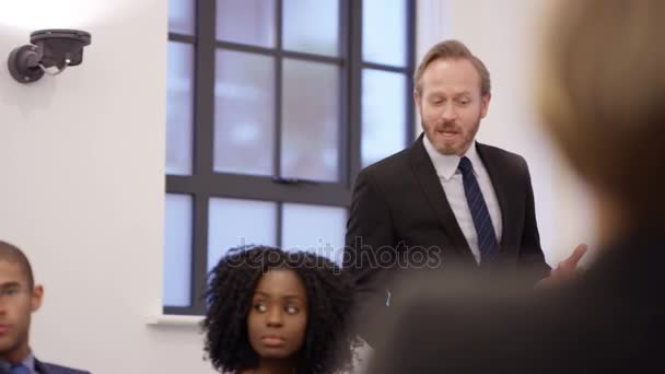 4k Business Executives In Boardroom Meeting Tv With News Report In Background