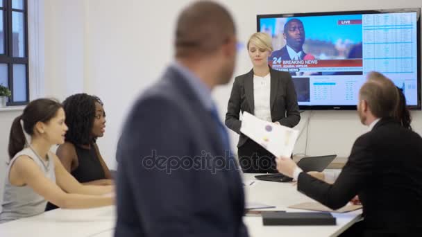 4k Business Executive In Boardroom Meeting Tv With News Report In Background