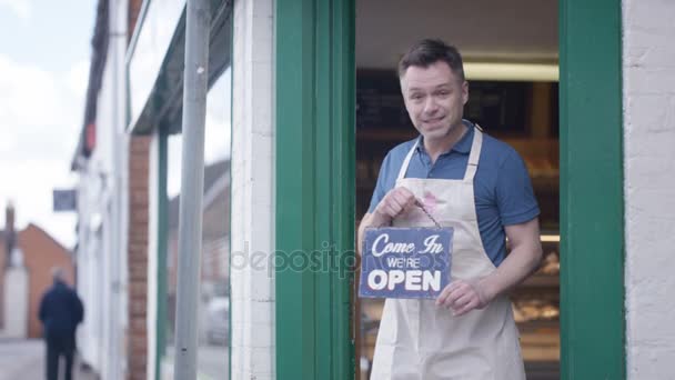 Happy Bakery Owner Holds Sign Show Open Business — Stock Video