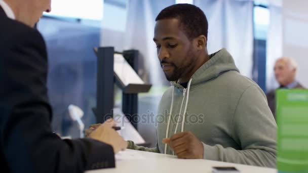 Modern City Bank Worker Assisting Customer Getting Signature Document — Stock Video