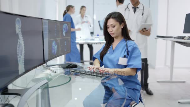 Medical Team Modern Clinic Looking Patient Scans Computer Screens — Stock Video