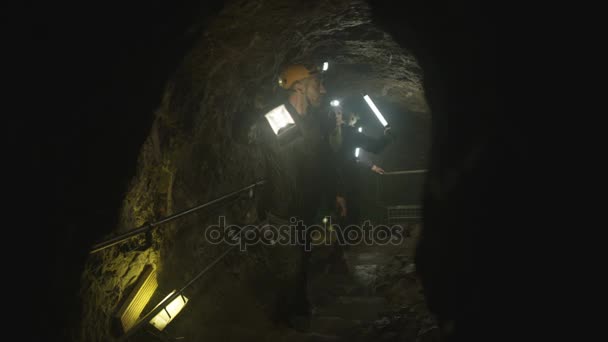 Team Potholers Hard Hats Lamps Exploring Underground Cave System — Stock Video