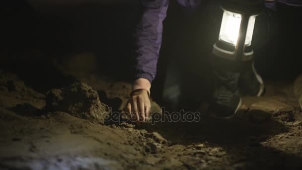 Geologist Exploring Underground Cave Studying Rock Formation — Stock Video