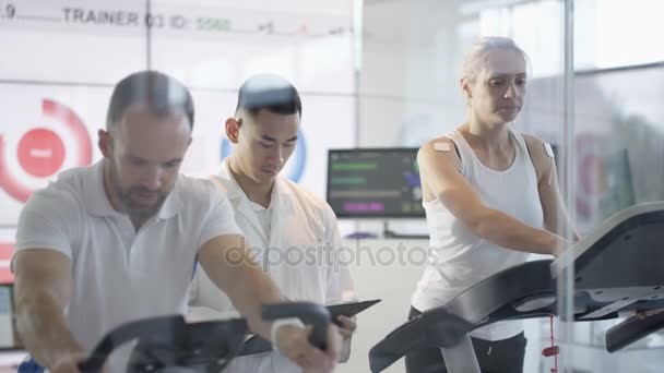 Man Woman Fitness Machines Being Tested Monitored Sports Scientist — Stock Video