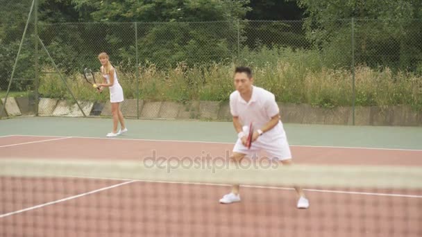 Mixed Doubles Tennis Players Enjoying Game Outdoor Court Summer — Stock Video