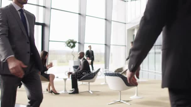 Businessmen Greeting Each Other Meeting Area Large Modern Office Building — Stock Video