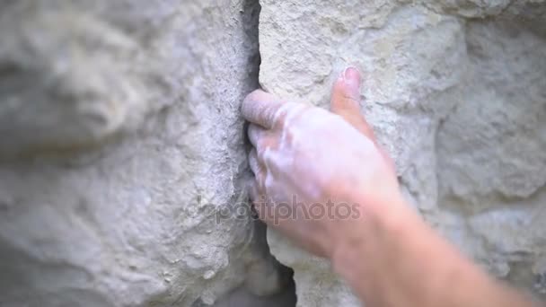 Close Hand Rock Climber Gripping Crevice Stone — Stock Video