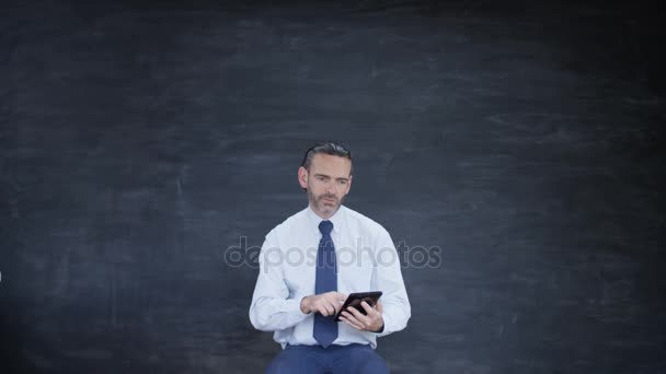 Man Working Computer Tablet Looking Inspiration Blank Chalkboard — Stock Video