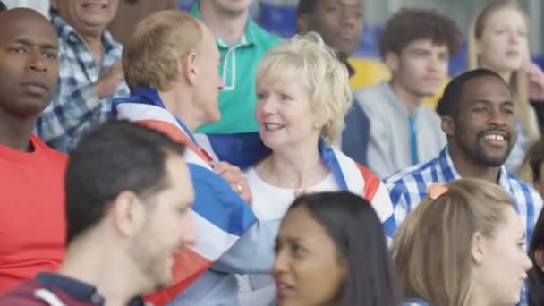 Affectionate Mature Couple Crowd Sports Event Draped British Flag — Stock Video