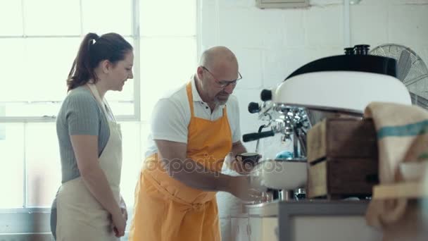 Cafe Business Owner Training Staff Member Use Coffee Machine — Stock Video
