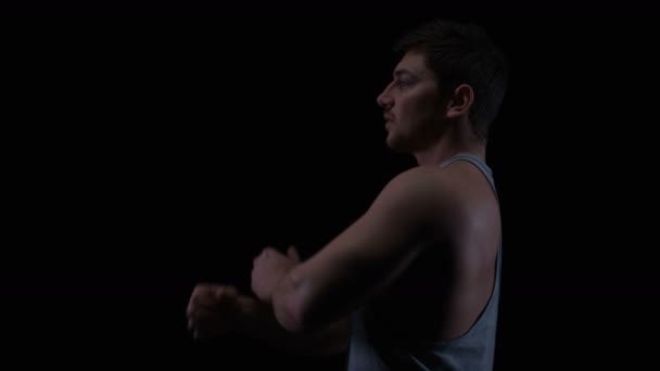 Fit Young Man Muscular Physique Stretching Black Background — Stock Video