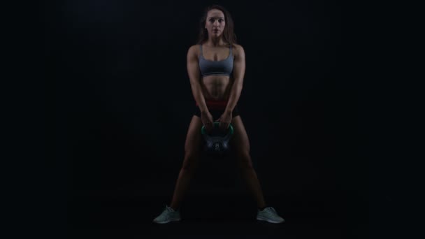 Fit Young Woman Working Out Kettle Bell Weight Black Background — Stock Video