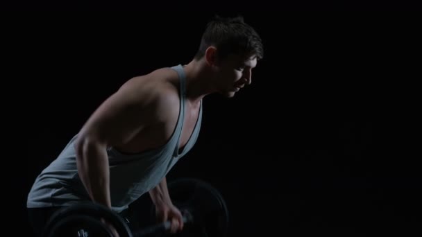 Fit Young Man Muscular Physique Lifting Weights Black Background — Stock Video