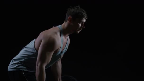 Fit Young Man Muscular Physique Lifting Weights Black Background — Stock Video