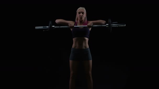 Fit Woman Athletic Physique Lifting Weights Black Background — Stock Video