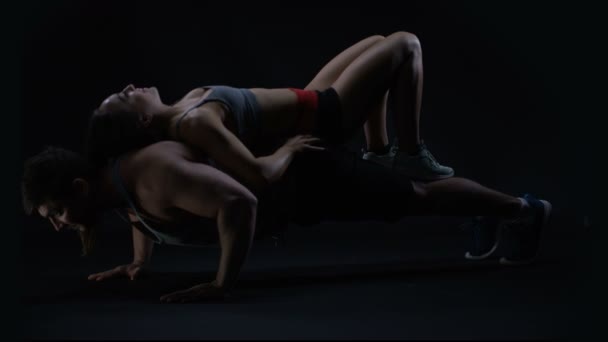 Muscular Man Doing Press Ups Girl His Back Add Resistance — Stock Video