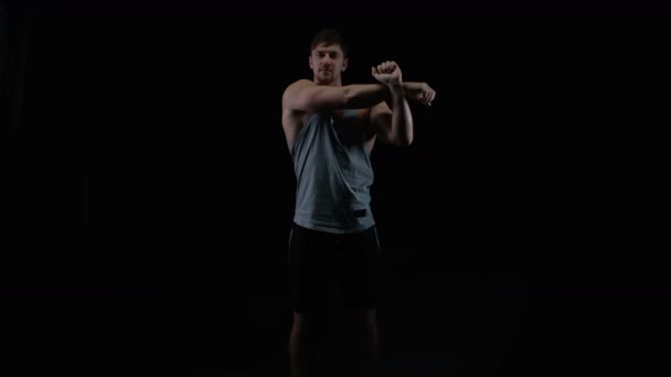 Fit Young Man Muscular Physique Stretching Black Background — Stock Video