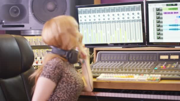 Young Sound Engineer Recording Studio Using Laptop Mixing Desk — Stock Video