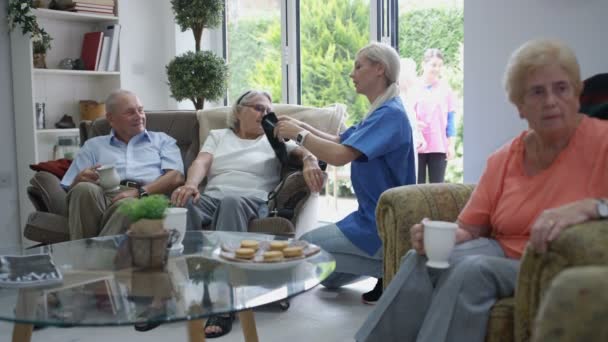 Caring Nurse Checking Elderly Lady Blood Pressure Nursing Home — Stock Video