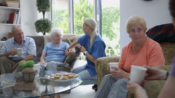 Caring Nurse Checking Elderly Lady Blood Pressure Nursing Home — Stock Video