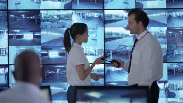 Surveillance Officer Communicating Earpiece Control Room — Stock Video