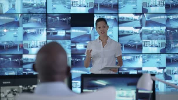 Security Officer Communicating Staff Observation Control Room — Stock Video