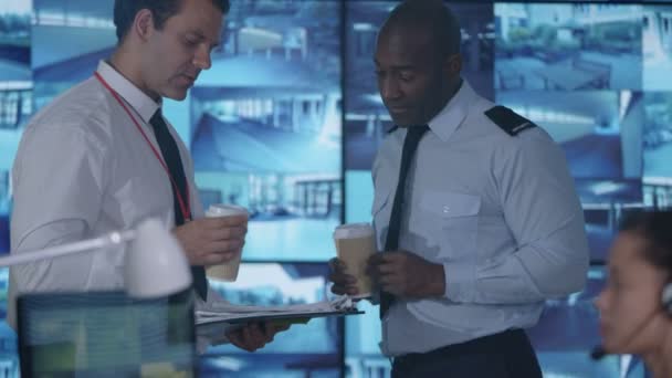 Security Team Having Discussion Control Room Multiple Video Screens — Stock Video