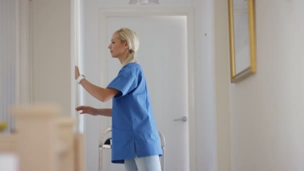 Nurse Working Residential Care Home Followed Out Bedroom Astronaut — Stock Video
