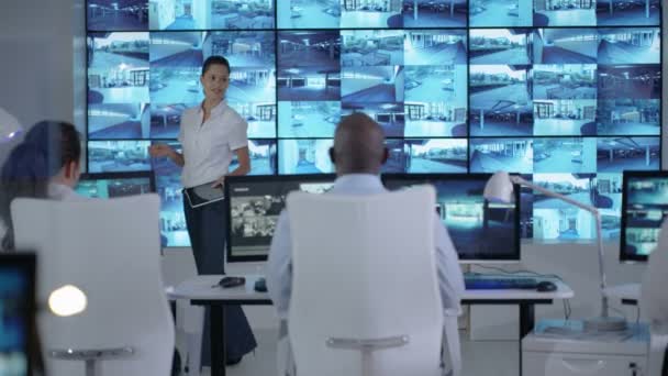 4k Security Officer Communicating With Staff In Observation Control Room
