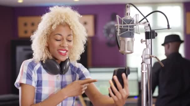 Female Vocalist Recording Studio Using Mobile Phone Video Call — Stock Video