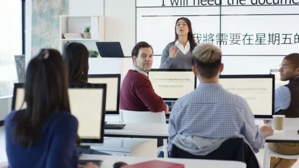 Adult Students Language Class Video Screen Showing Asian Characters — Stock Video