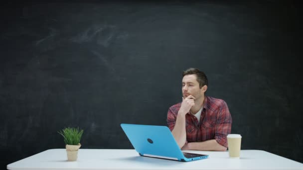 Man Working Laptop Looking Inspiration Chalkboard Background — Stock Video