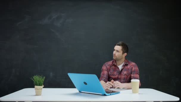 Man Working Laptop Looking Inspiration Chalkboard Background — Stock Video