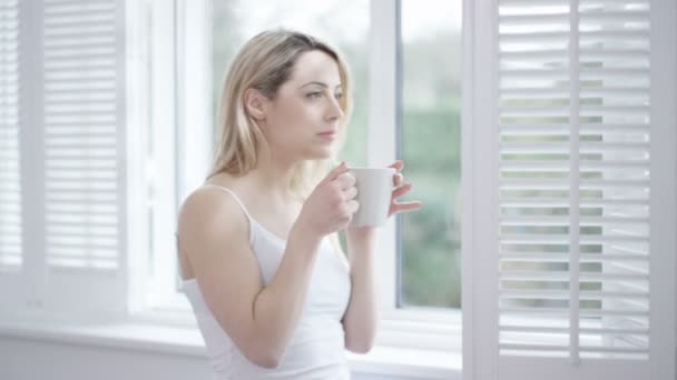 Woman Enjoying Cup Coffee Home Looking Out Window — Stock Video