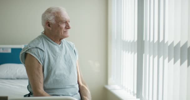 Portrait Smiling Elderly Patient Sitting His Bed Hospital Room — Stock Video