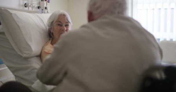 Happy Senior Couple Hospital Room Man Wheelchair Visiting Sick Wife — Stock Video