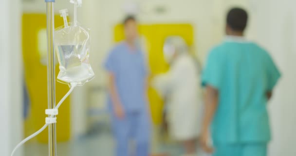 Blurred View Hospital Staff Patients Focus Saline Drip Foreground — Stock Video