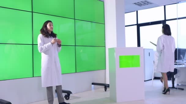 Medical Service Adviser Giving Presentation Interacting Green Screen Video Wall — Stock Video