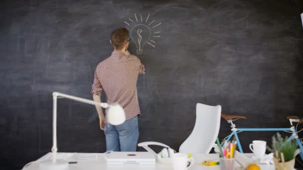 Man Drawing Light Bulb Blackboard Education Creative Office Concept — Stock Video