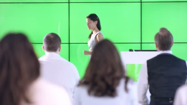 Young Businesswoman Giving Presentation Interacting Green Screen Video Wall — Stock Video