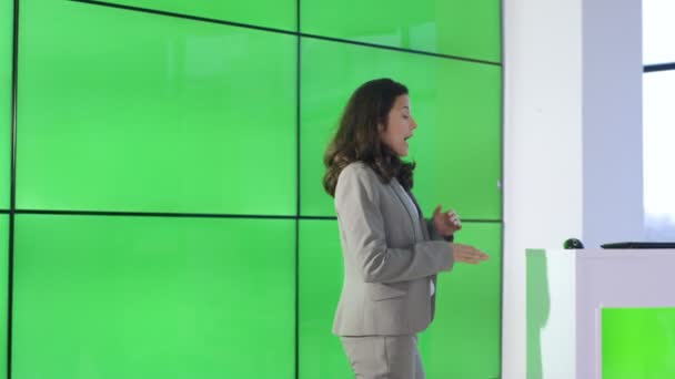 Businesswoman Giving Presentation Interacting Green Screen Video Wall — Stock Video